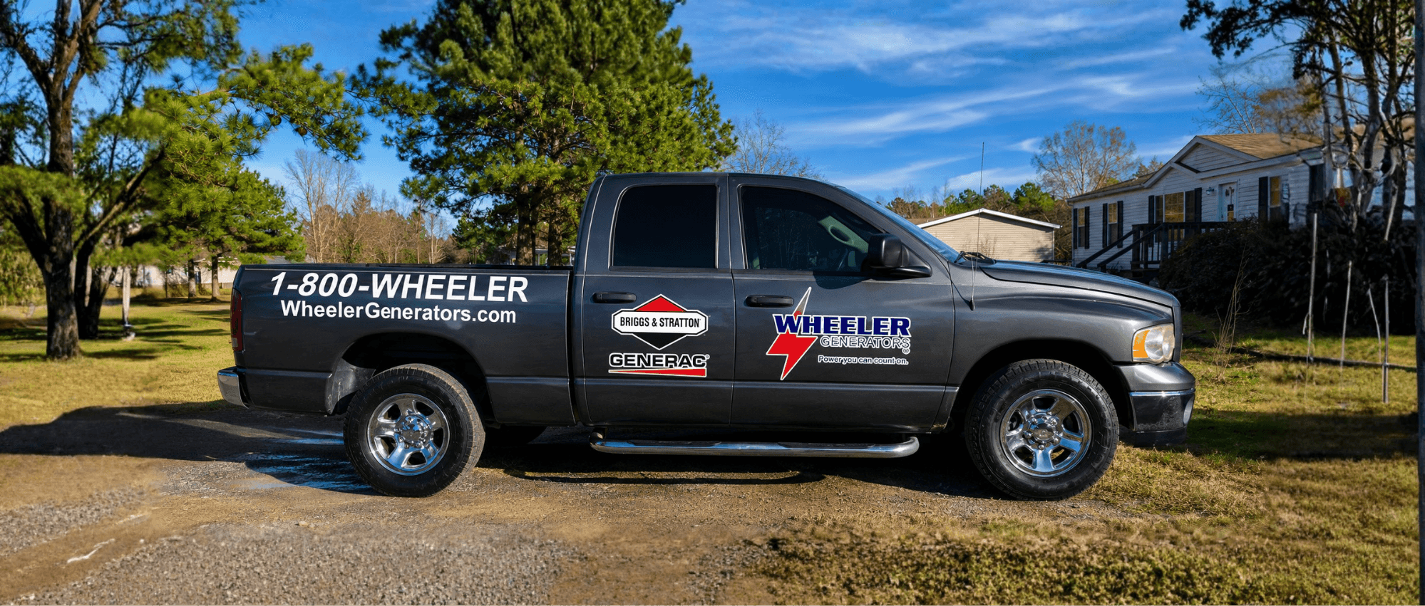 Wheeler Generators branded work truck on a residential job site
